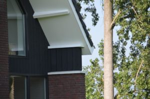 drijvers-oisterwijk-nieuwbouw-woonhuis-exterieur-pannendak-metselwerk-houten-gevel-hooimijt-bijgebouw-schoorsteen-ramen-deuren (15)
