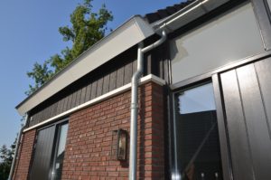 drijvers-oisterwijk-nieuwbouw-woonhuis-exterieur-pannendak-metselwerk-houten-gevel-hooimijt-bijgebouw-schoorsteen-ramen-deuren (26)